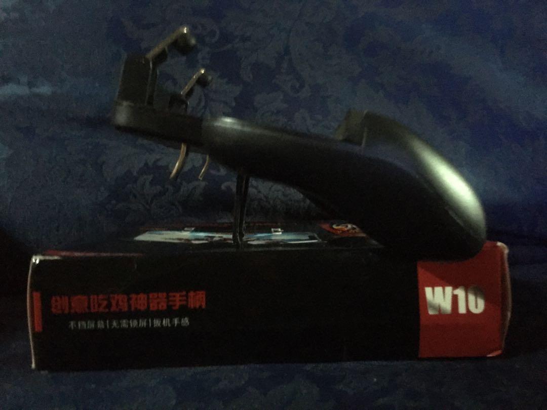 W10 Mobile game controller (Category: Controllers) located in Manila. Submitted by dl_online_shop (Listing ID 1012275644, Image 3). Description: Accessory Type : Smart Phone Gaming Controller Brand : Other Compatible with : Mobile Phones Descriptions: Made of high quality material, ergonomic design, very durable. Flexibility, precision, comfort, easy to control. Compact and portable. Single point support on the top of the phone card slot can effe