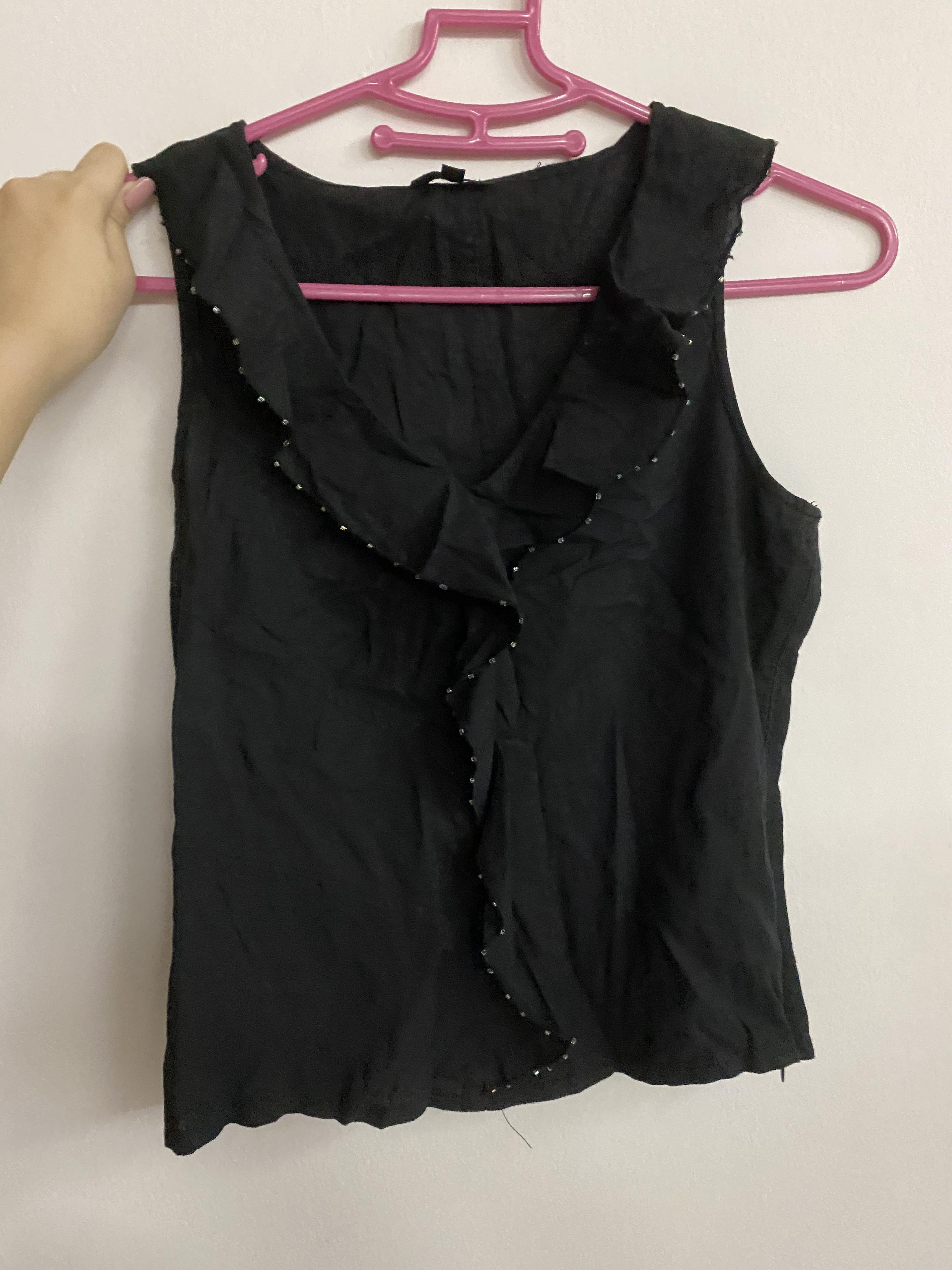 black ruffle sleeveless top
