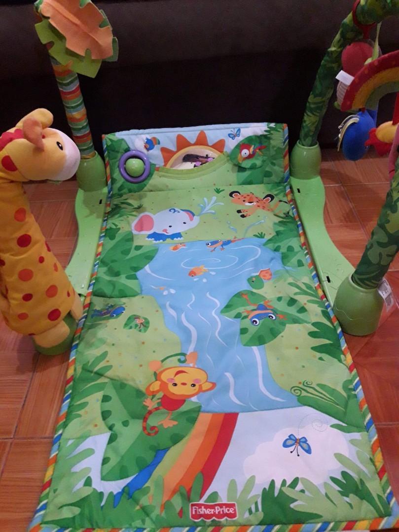Fisher Price Rainforest Gym (Category: Bathtub & Bath Accessories) located in Marikina City. Submitted by yellowepicurean (Listing ID 1019747448, Image 3). Description: In good condition but the hanging toys are not the original ones. The velcrows on the sides are not there anymore..