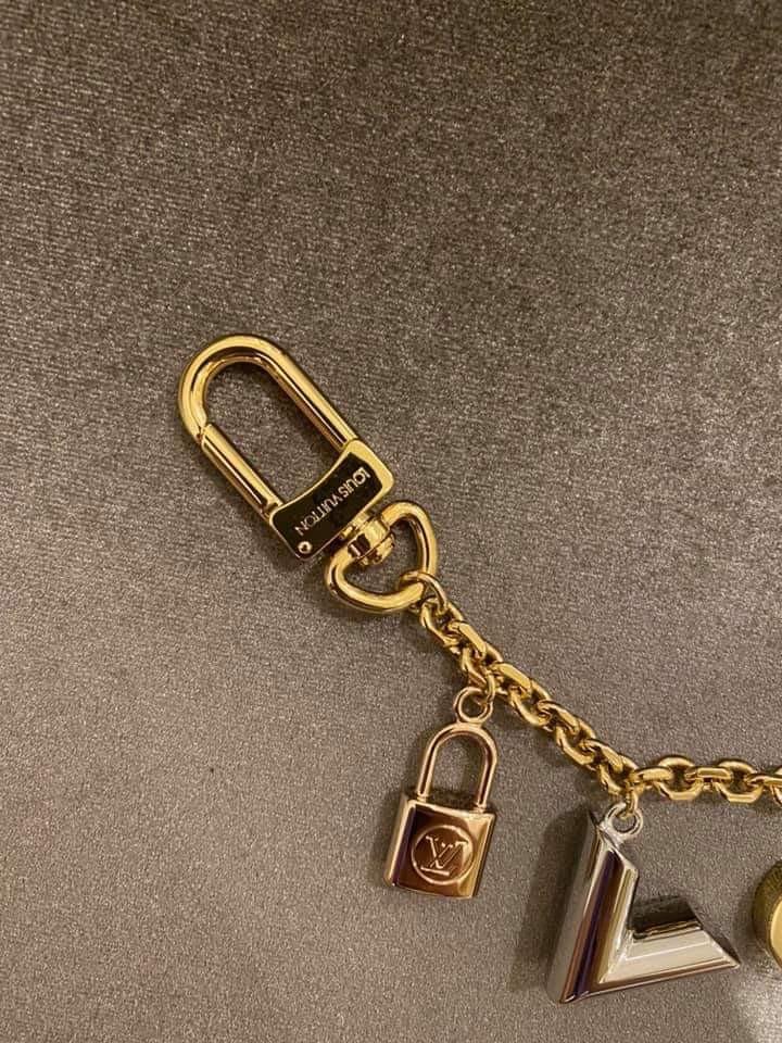 LV Kaleido Key Holder & Bag Charm (Category: Luxury Accessories) located in Carmona. Submitted by bagislifeshop (Listing ID 1019577827, Image 3). Description: A stunning collectible, Limited collection Dual function keyring & bag charm Signature charms in various metal tones Chain in shiny gold hardware Full length- 10.5 inches Comes w/dustbag and box.