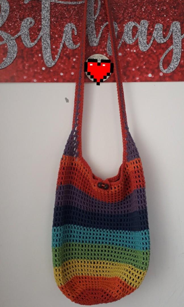 Thailand Crochet Bag (Category: Cross-body Bags) located in Las Pinas. Submitted by betchays (Listing ID 1019672858, Image 1). Description: Hand Knitted bag bought in Thailand (2018) *multi color *never used *no flaws MOP: GCash SF: Php75 - Metro Manila.