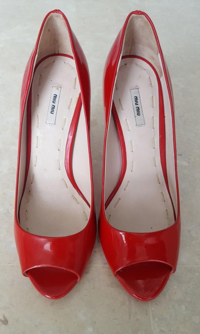 Red patent leather peep toe pumps top