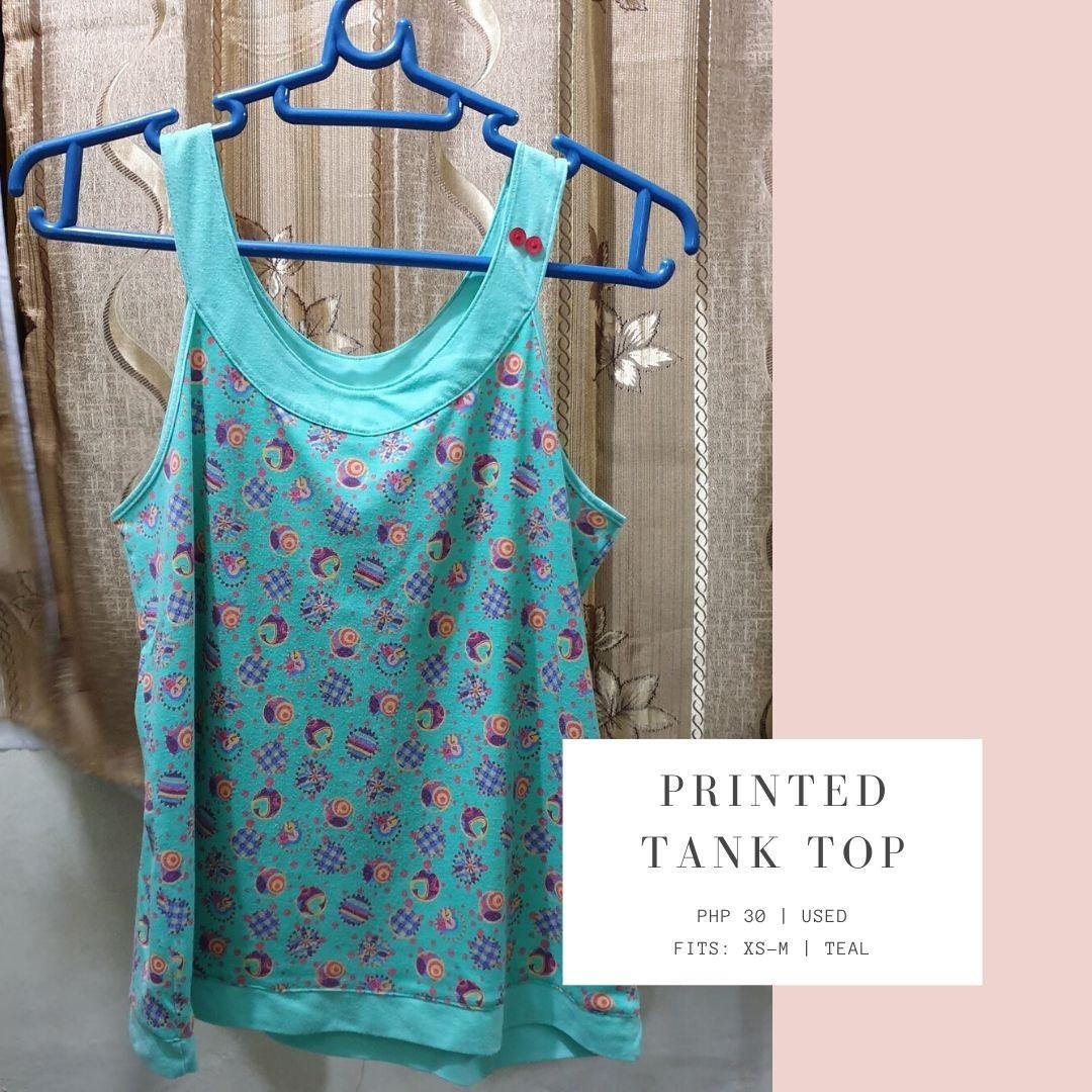 Printed Teal Tank Top (Category: Sleeveless) located in Caloocan City. Submitted by ancdeclutters (Listing ID 1019911411, Image 1). Description: Fits XS-M Barely Used Colorful printed pattern on teal top with red button detail Last used before covid-19, washed and disinfected. MOP: BDO bank transfer, Gcash Feel free to message us for inquiries..