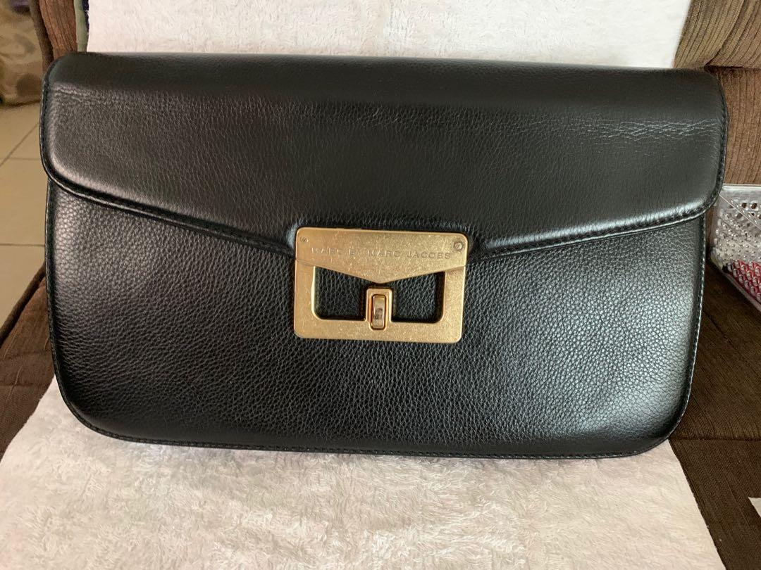 Authentic Marc Jacobs Clutch bag (Category: Luxury Bags & Wallets) located in Makati City. Submitted by mintbags (Listing ID 1020121859, Image 1). Description: Authentic Marc Jacobs Clutch bag Leather Slightly used; 3-4times Lang nagamit Only P3,300.00.