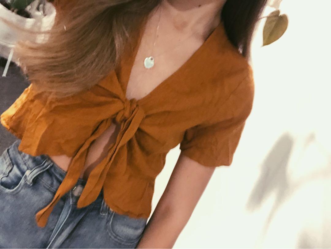 Burnt orange wrap top (Category: Clothes) located in Auckland. Submitted by durri (Listing ID 1020058127, Image 1). Description: Size s Linen style .