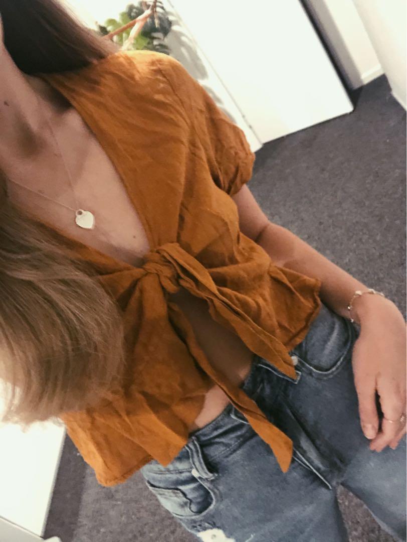 Burnt orange wrap top (Category: Clothes) located in Auckland. Submitted by durri (Listing ID 1020058127, Image 3). Description: Size s Linen style .