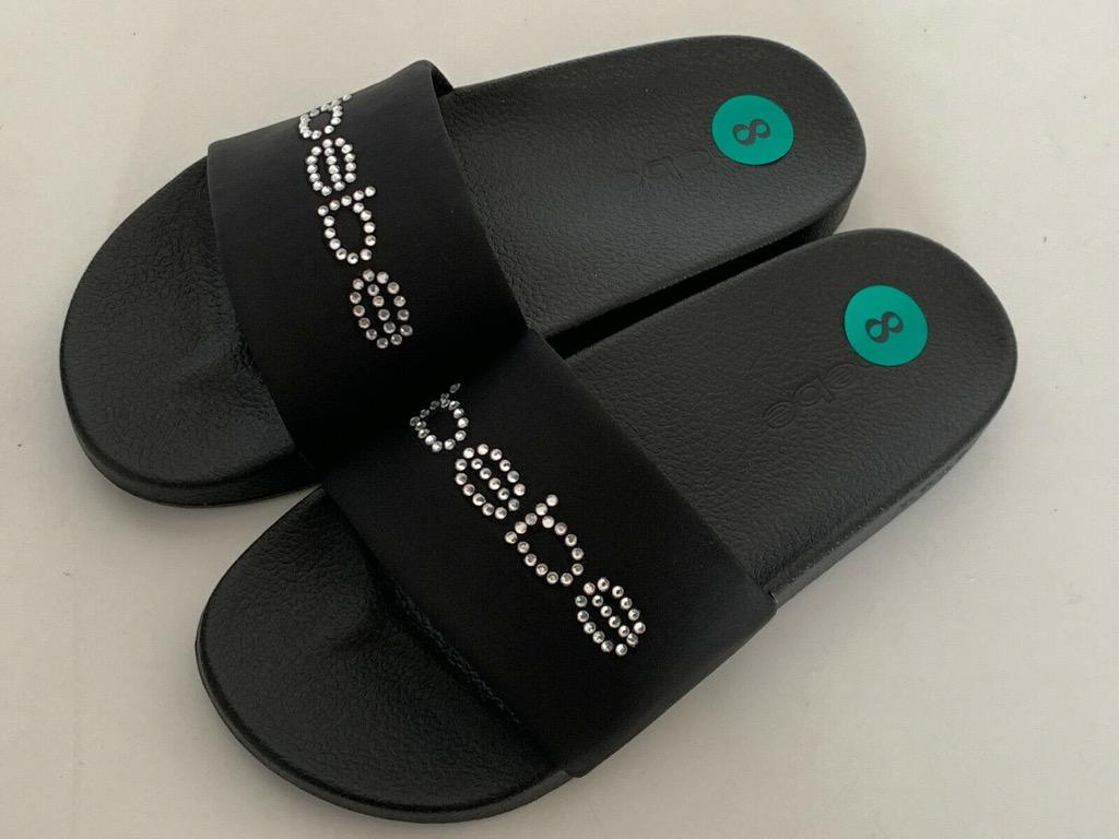 NEW BEBE WOMEN S FELIZIA BLACK SLIP ON SLIDES FLIP FLOPS SLIPPERS