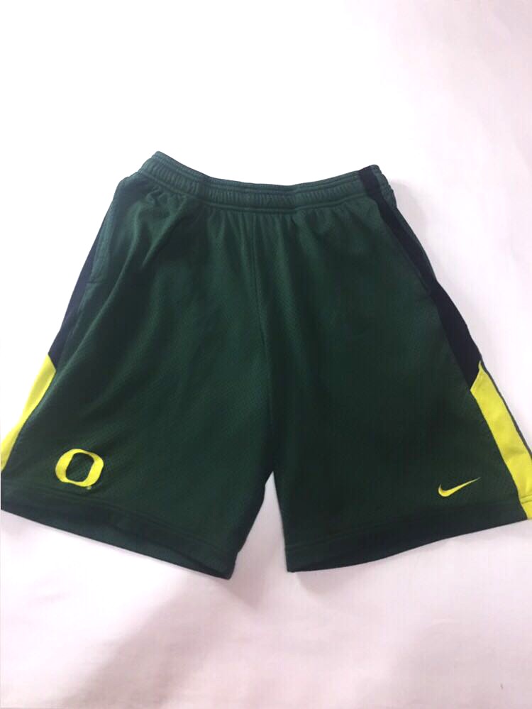 green nike shorts