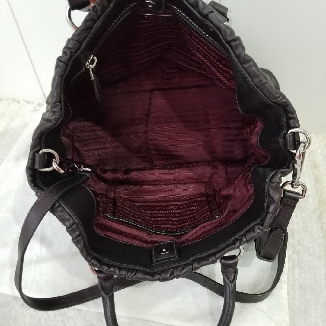 Prada Nappa Leather Eggplant color (Category: Purses & Pouches) located in Pasig City. Submitted by powerly75 (Listing ID 1020438302, Image 2). Description: Authentic Excellent condition No scuffings only light scratches on the leather Clean inside and out Size: 10 x 14 x 5 inches Inclusions: dust bag and strap Free shipping within Metro Manila after BPI/Gcash payment Text for inquiries: 09985301150.