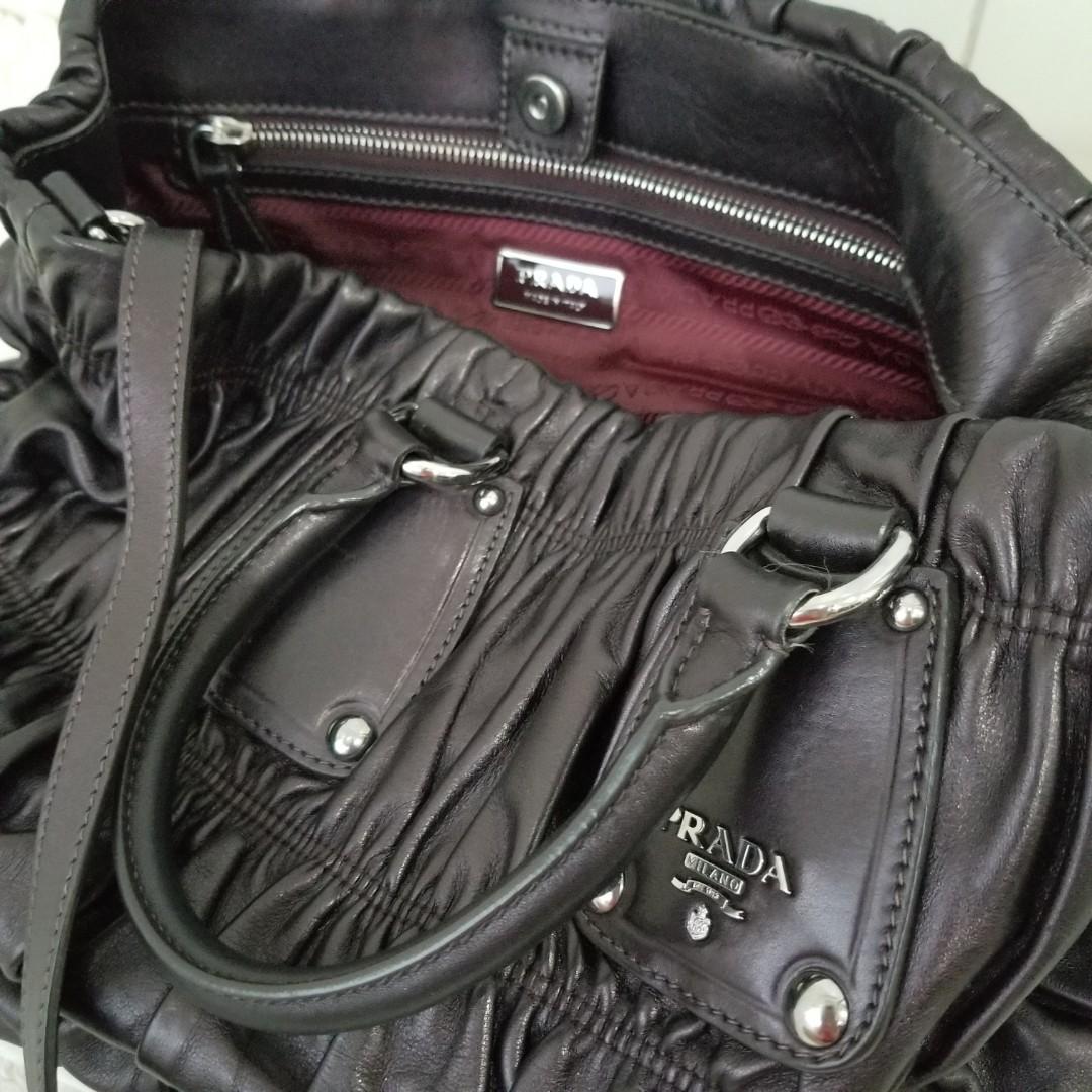 Prada Nappa Leather Eggplant color (Category: Purses & Pouches) located in Pasig City. Submitted by powerly75 (Listing ID 1020438302, Image 3). Description: Authentic Excellent condition No scuffings only light scratches on the leather Clean inside and out Size: 10 x 14 x 5 inches Inclusions: dust bag and strap Free shipping within Metro Manila after BPI/Gcash payment Text for inquiries: 09985301150.
