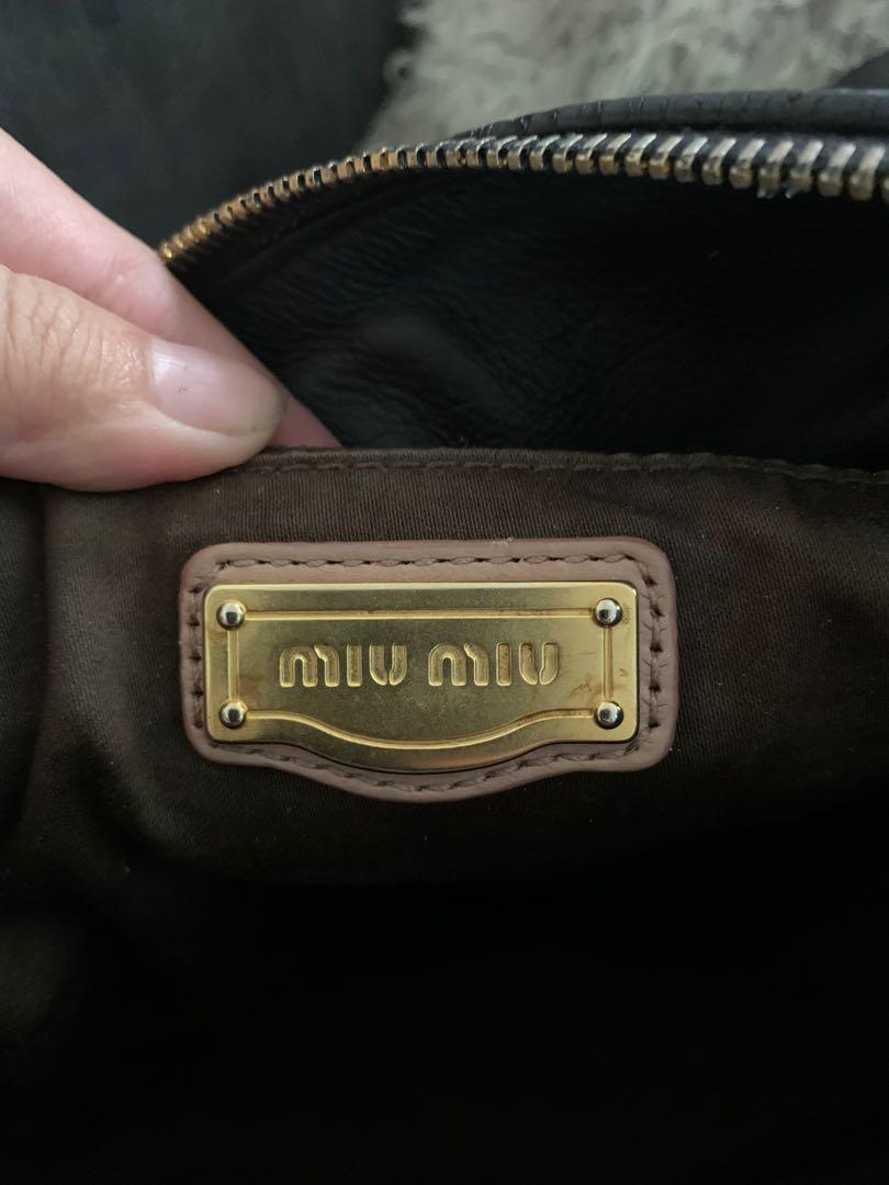 Miu miu bow bag (Category: Luxury Bags & Wallets) located in Manila. Submitted by imsojelica (Listing ID 1020624380, Image 3). Description: Preloved miu miu bow bag Recolored to black from beige Ipag bag spa nyo na lang to have leather reconditioned All in all very good condition .