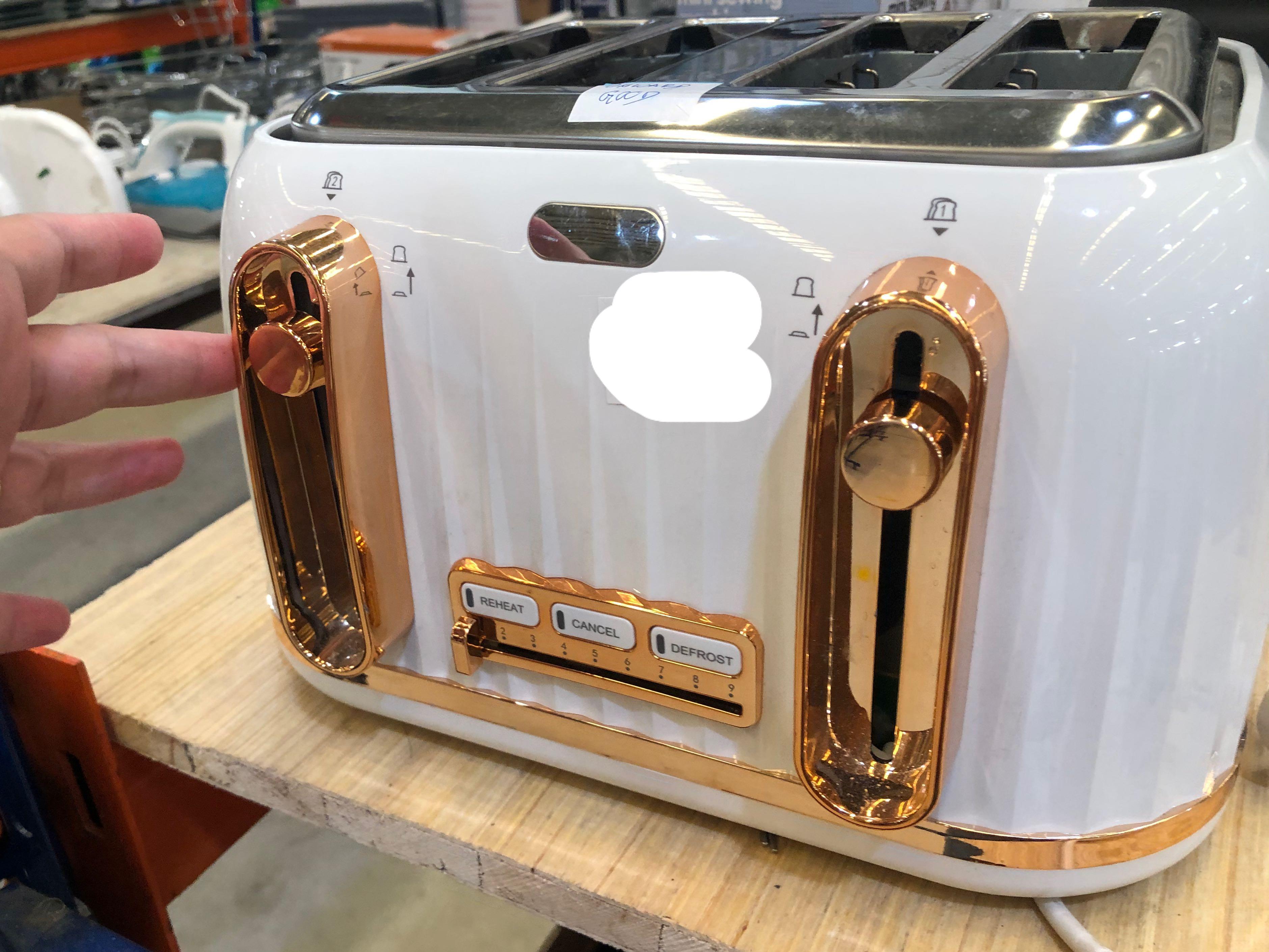 white and gold toaster