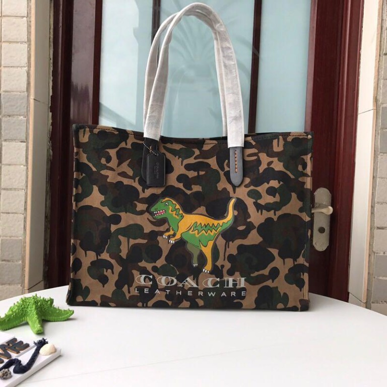 Coach Unisex Dinosaur Camouflage Canvas Tote Bag Handbag Shoulder Bag Women S Fashion Bags Wallets Handbags On Carousell Coach 1941 coach 1941 'skinny 34' dinosaur embossed leather tote available at #nordstrom. coach unisex dinosaur camouflage canvas tote bag handbag shoulder bag