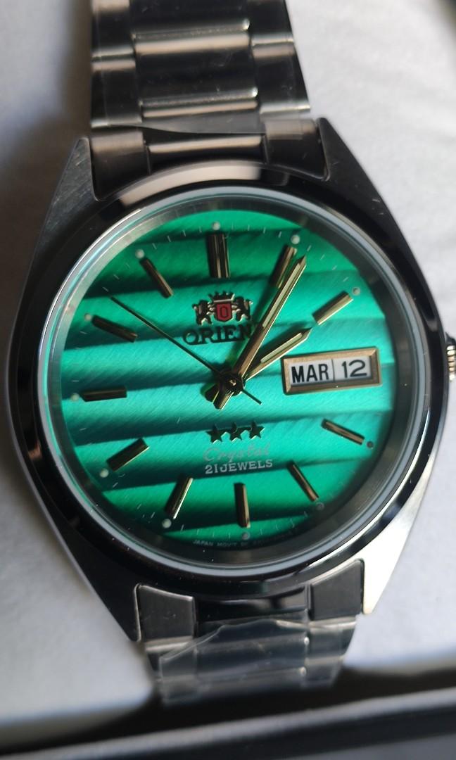 Orient tri star green sale