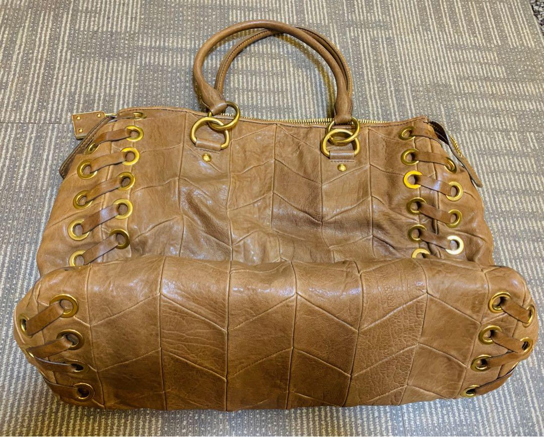 Preloved Authentic Miu Miu Hobo Bag (Category: Luxury Bags & Wallets) located in Pasig City. Submitted by mikebyme (Listing ID 1021908986, Image 1). Description: Good condition, minimal sign of usage.