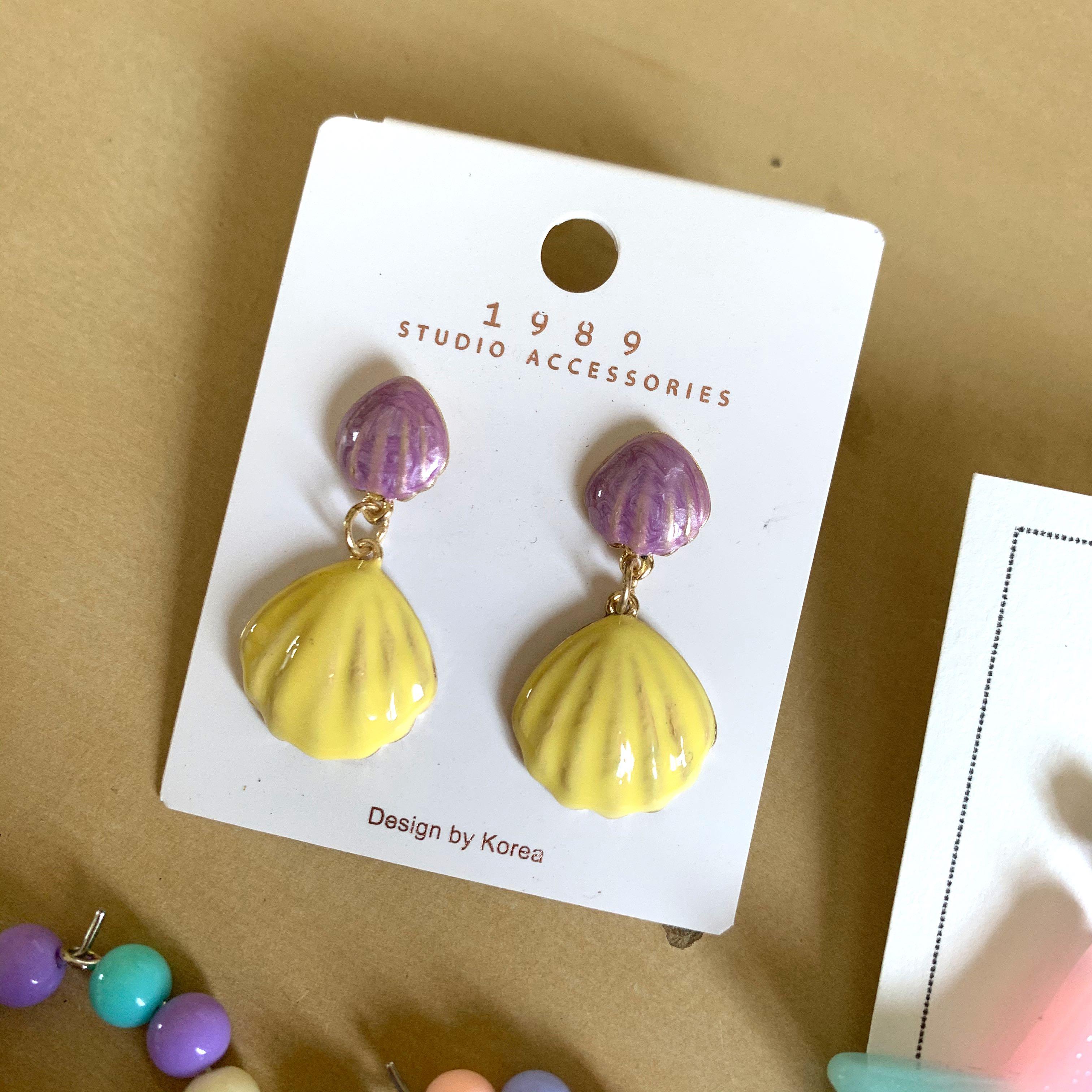 assorted earrings (Category: Earrings) located in Singapore. Submitted by chloeeeee_ (Listing ID 1017688542, Image 4). Description: hi! i’m selling away 3 pairs of brand new & not worned earrings!! do scroll through all the pictures to have a close-up look at each pair ((-: colourful/pastel star & moon earring (2nd pic): $5 mailed pastel beads earring (3rd pic): $4 mailed **shell earring (4th pic): $2.50 mailed **naturally comes with the blackish