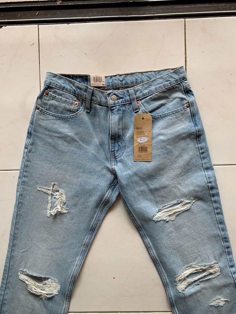 Levi 511 ripped sales jeans
