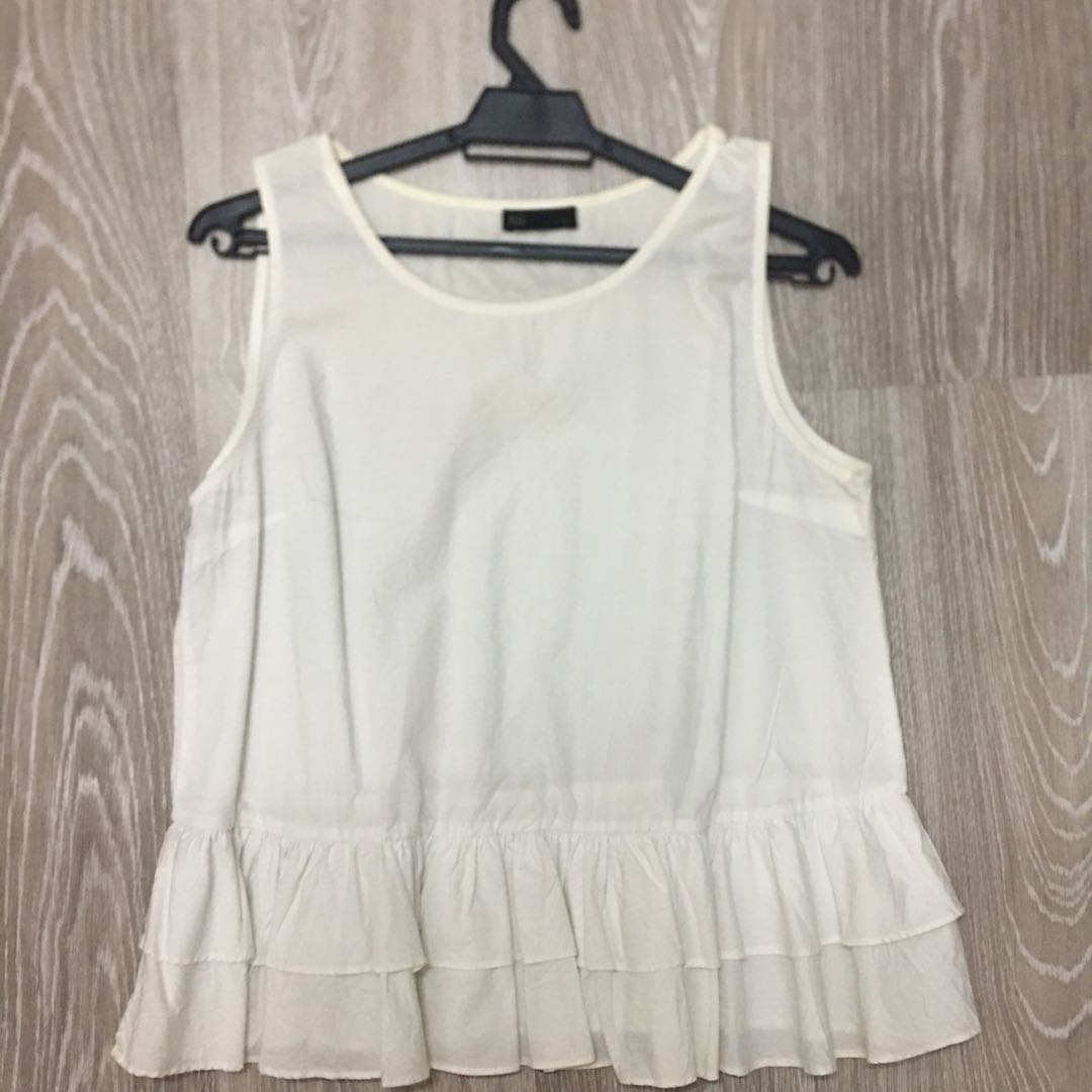 white shirt with ruffle bottom