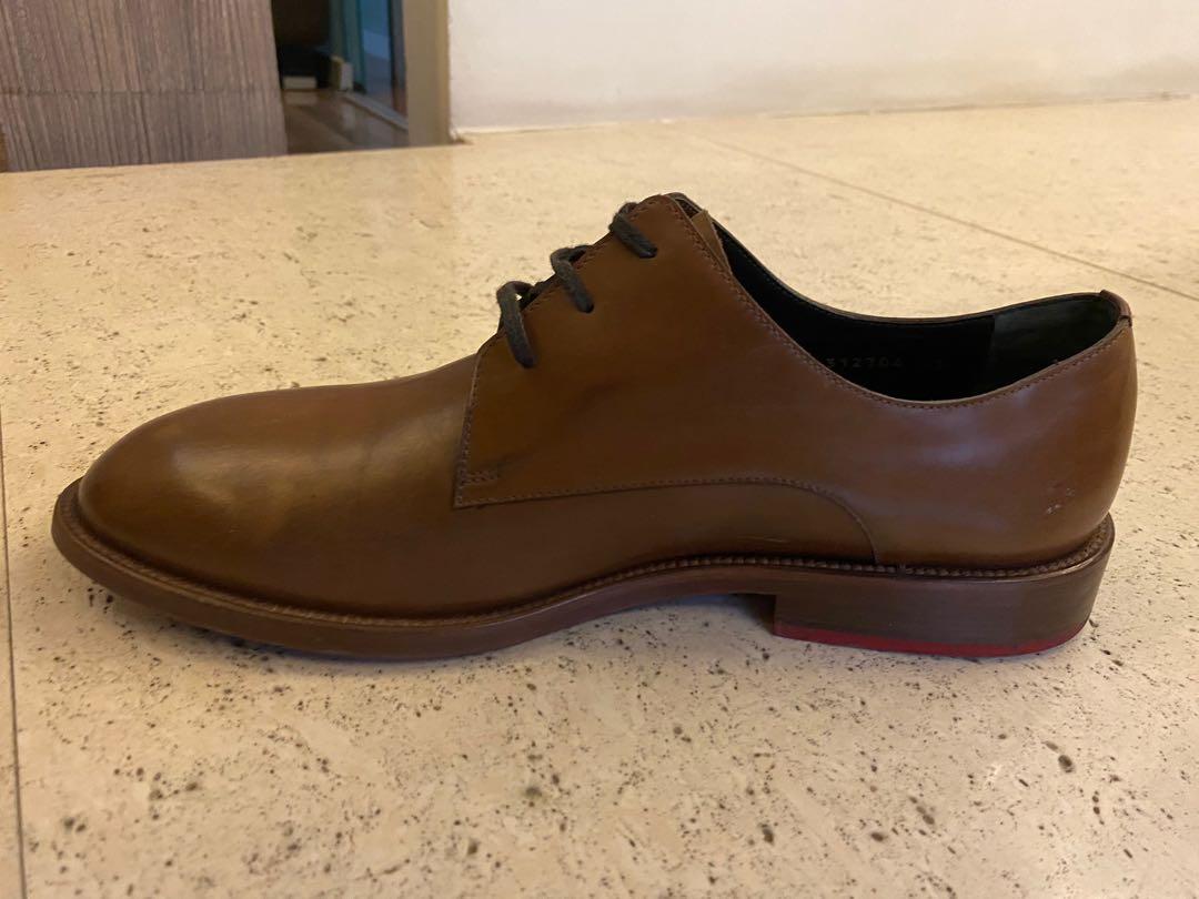 Balenciaga Brown Leather Shoes (Category: Dress Shoes) located in Pasig City. Submitted by saxmax (Listing ID 1022219508, Image 3). Description: Brown leather shoes with red soles. Used. P4,000.00 + SF.