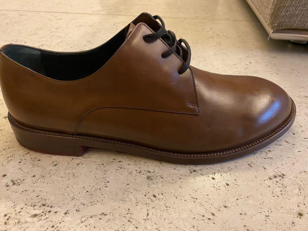 Balenciaga Brown Leather Shoes (Category: Dress Shoes) located in Pasig City. Submitted by saxmax (Listing ID 1022219508, Image 1). Description: Brown leather shoes with red soles. Used. P4,000.00 + SF.