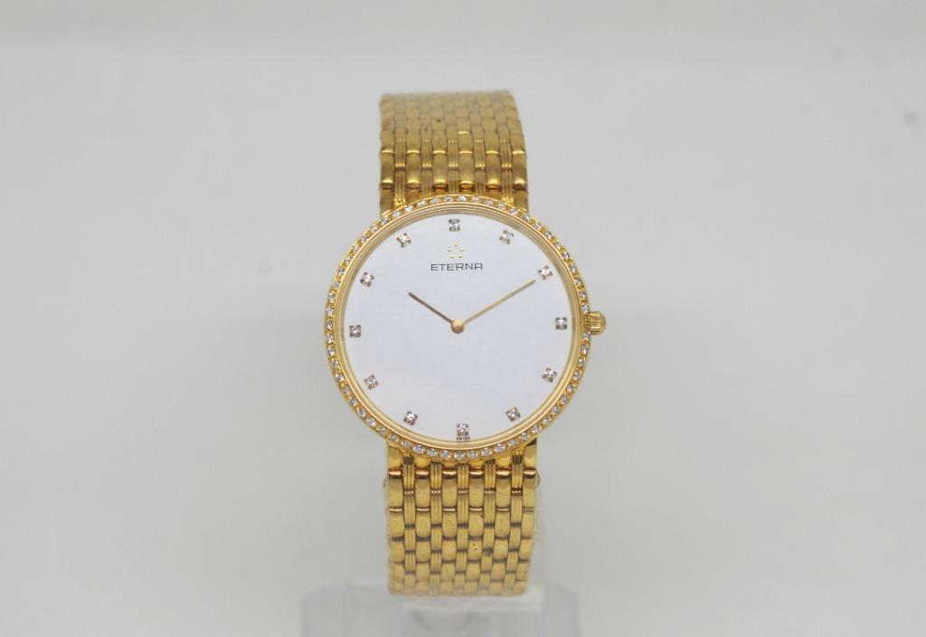 Gold watch with best sale diamond bezel