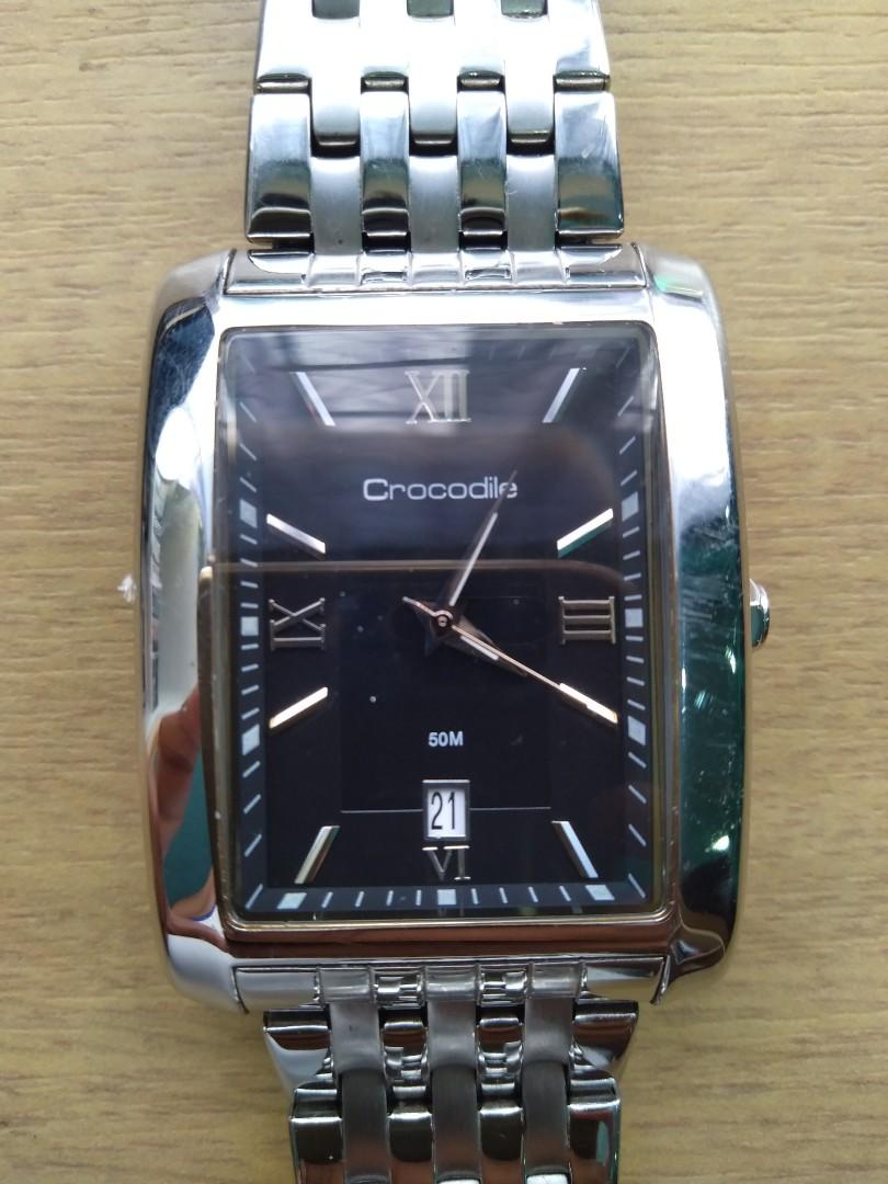 Crocodile men watch new arrivals