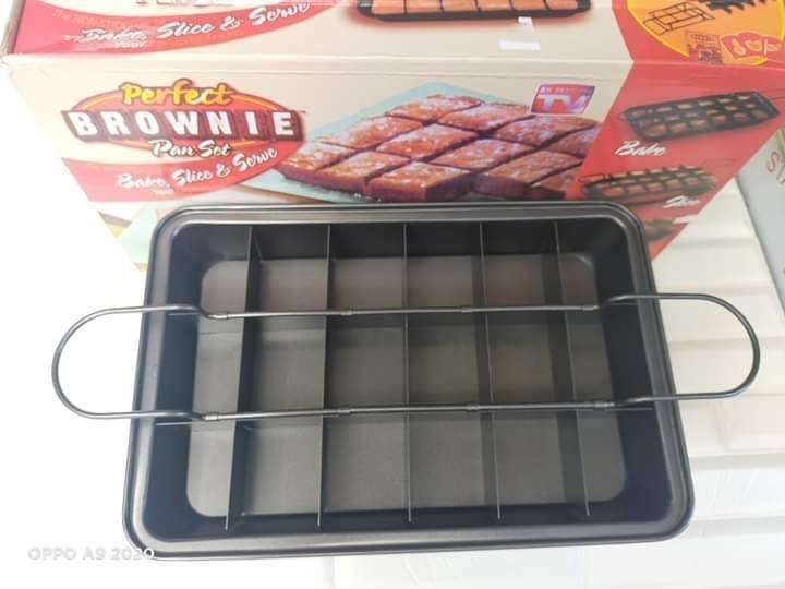 Brownie Pan Perfect (Category: Bakeware) located in Manila. Submitted by crisdancal (Listing ID 1023940609, Image 2). Description: Brownie pan set Make fluffy cakes, awesome bar cookies, or grandma's apple pie squares and so much more Patented design bakes each piece separately so they are flakey and crispy on the outside, but soft and gooey on the inside Non stick divider is so slipper not even yummy marshmallow treats will stick Serve pastries 