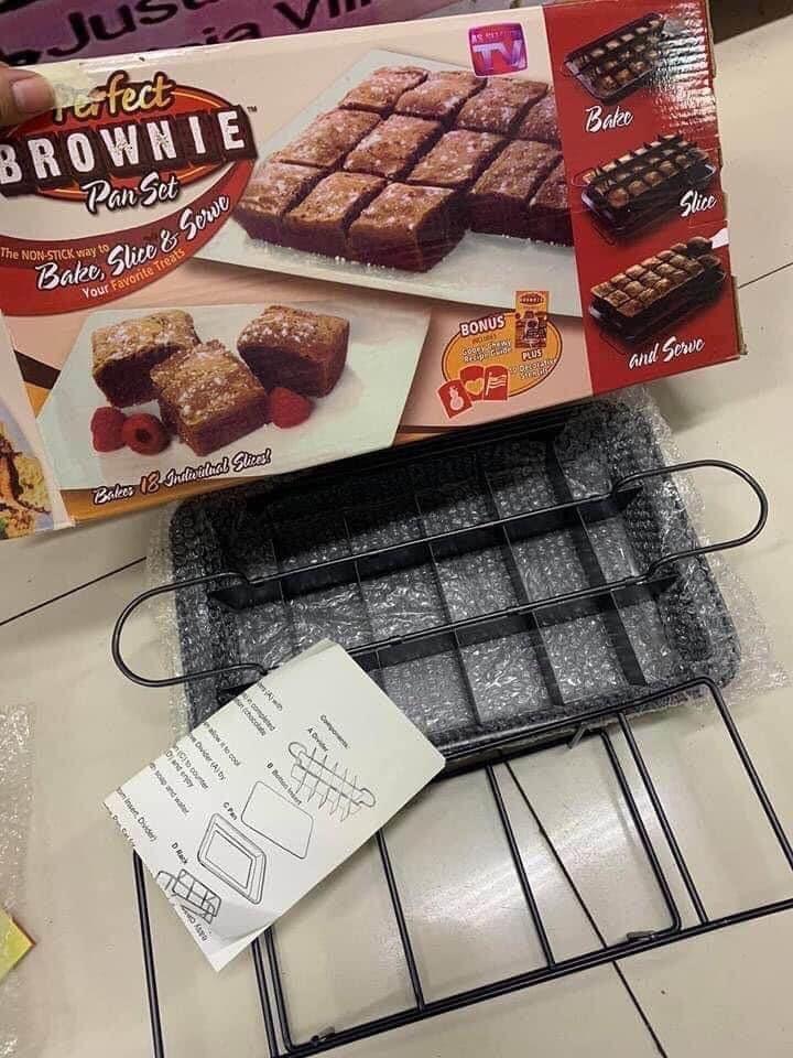 Brownie Pan Perfect (Category: Bakeware) located in Manila. Submitted by crisdancal (Listing ID 1023940609, Image 1). Description: Brownie pan set Make fluffy cakes, awesome bar cookies, or grandma's apple pie squares and so much more Patented design bakes each piece separately so they are flakey and crispy on the outside, but soft and gooey on the inside Non stick divider is so slipper not even yummy marshmallow treats will stick Serve pastries 