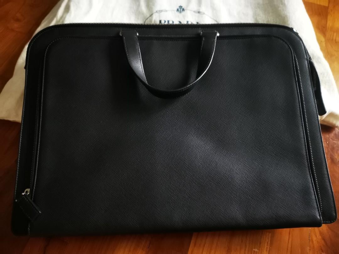 Prada Briefcase Saffiano Leather (Category: Bags & Wallets) located in Singapore. Submitted by goodoldrollie (Listing ID 1023973068, Image 2). Description: Prestine condition, used less than 10 times. Almost as good as new. Slight nego for serious buyer. Comes with dust bag. Selling as no longer working corporate..