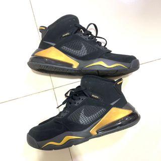 gold black nike shoes
