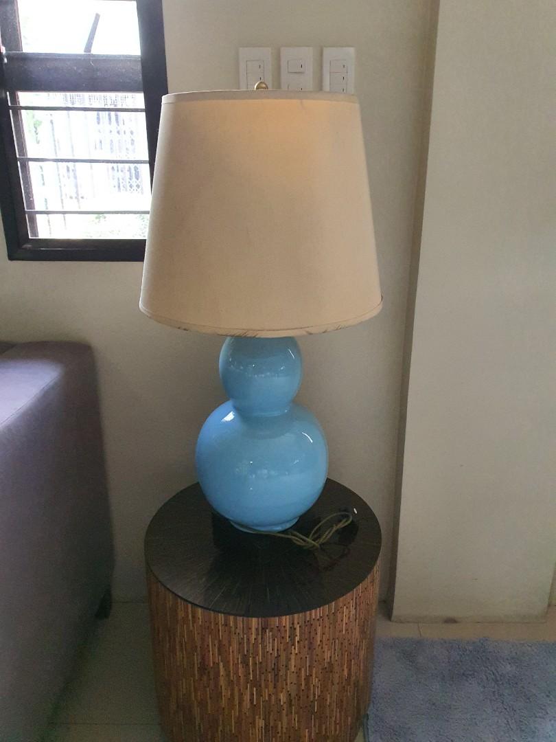 Ceramic table lamps (Category: Lighting) located in Marikina City. Submitted by twinkletosh14 (Listing ID 1017892927, Image 1). Description: used blue ceramic lamp 3k each 2 pcs available.