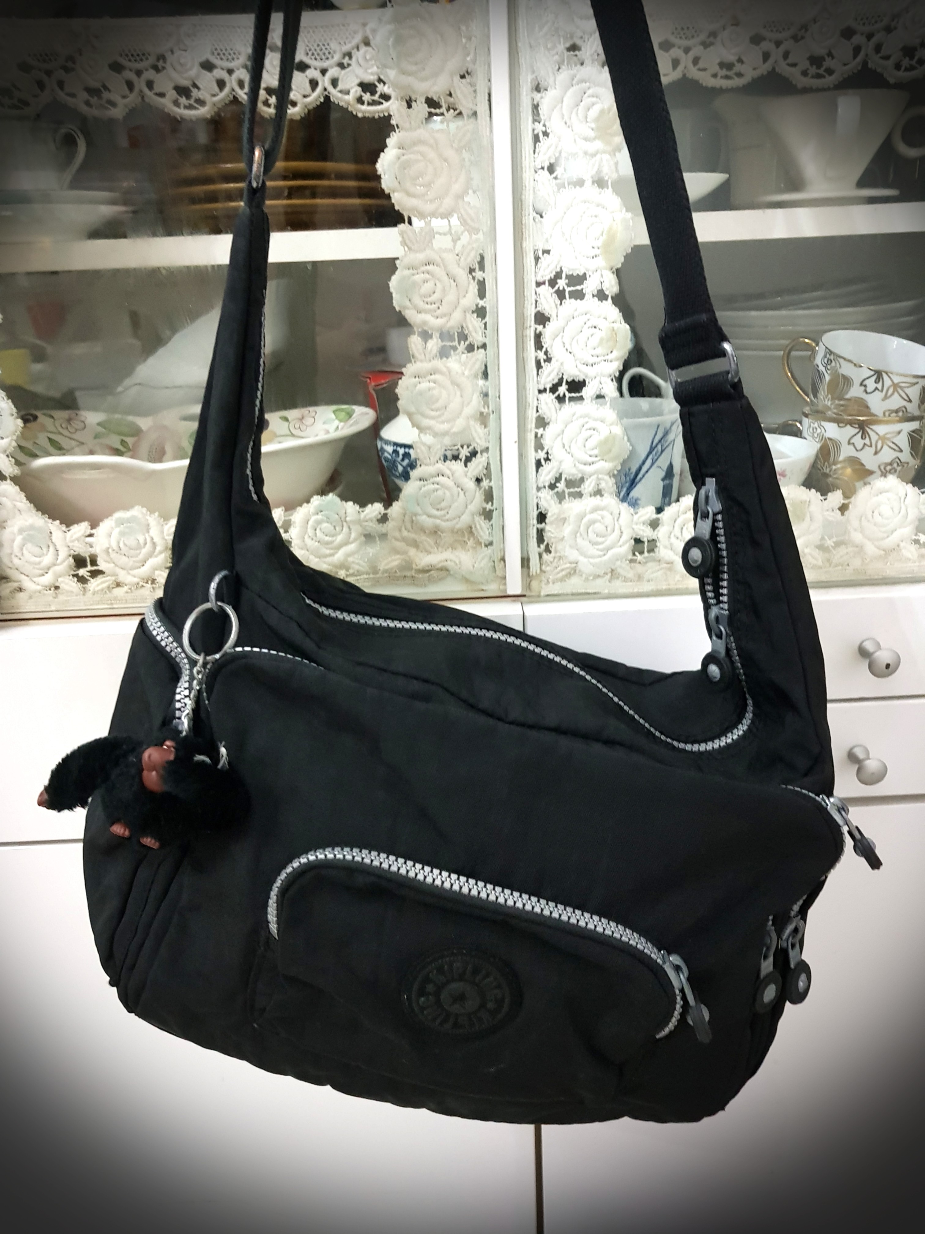 Kipling black top sling bag