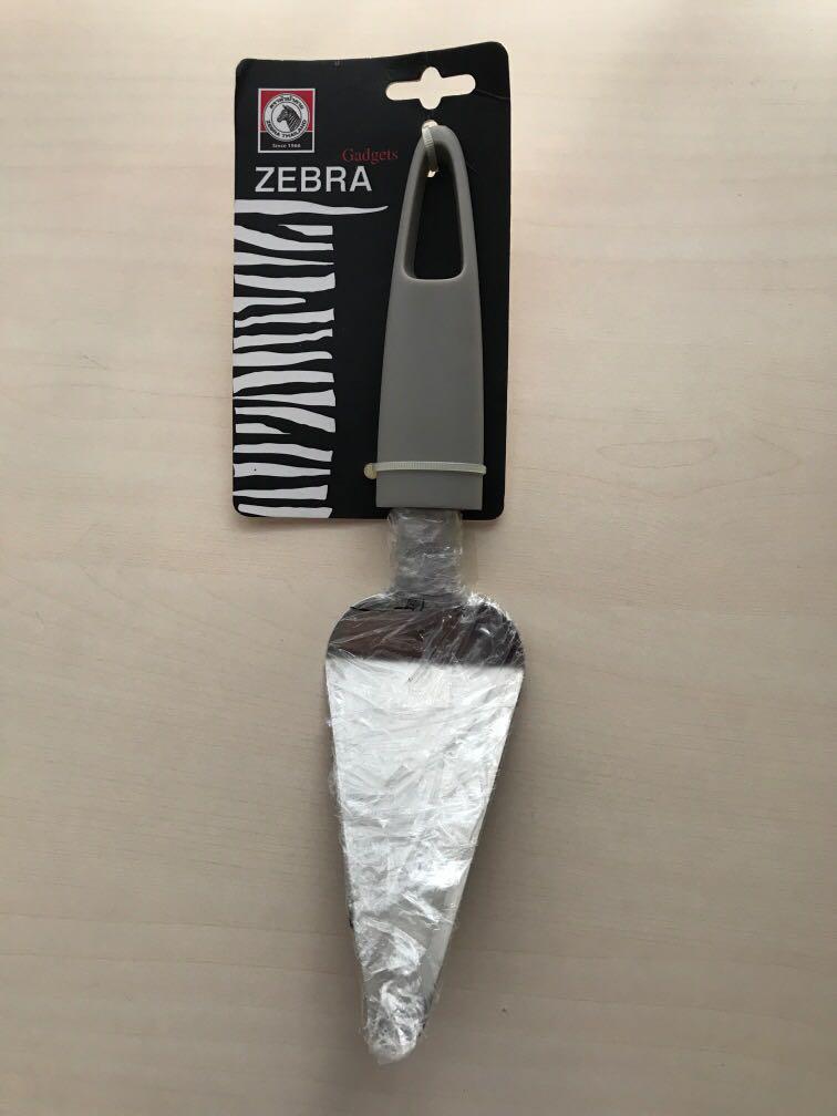Zebra Cake Server (Category: Food Organisation & Storage) located in Singapore. Submitted by anml_26 (Listing ID 1017965939, Image 1). Description: Branded Zebra. Excellent quality. Still in wrap.