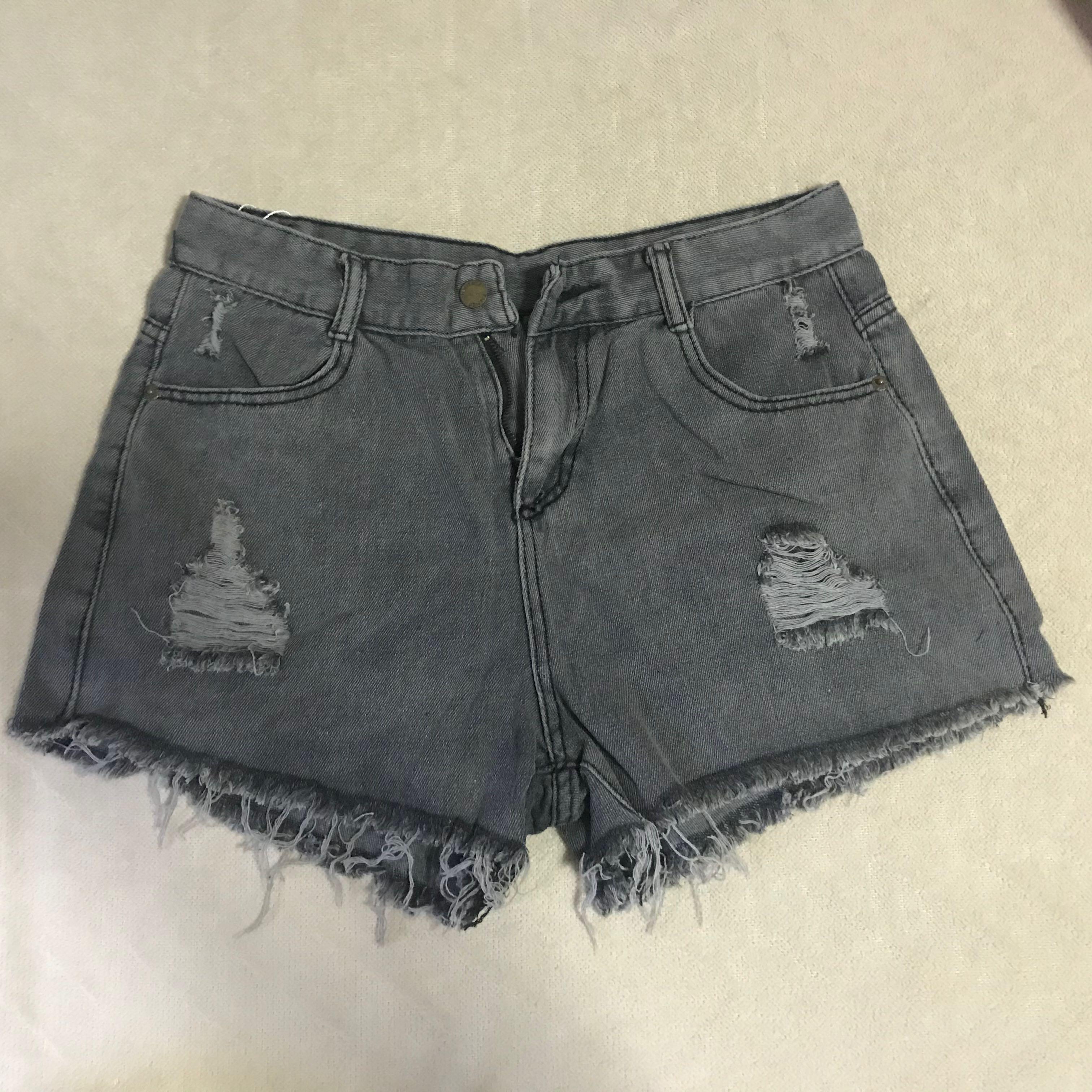 grey ripped shorts