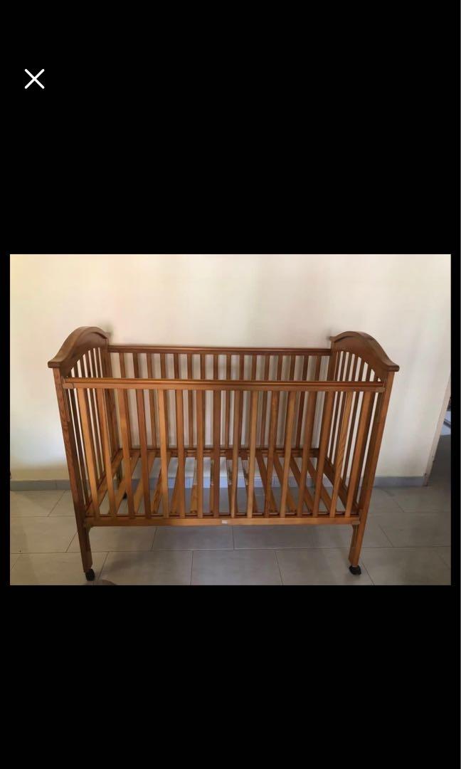 Solid wood baby cot convertible to toddler bed with mattress., Babies