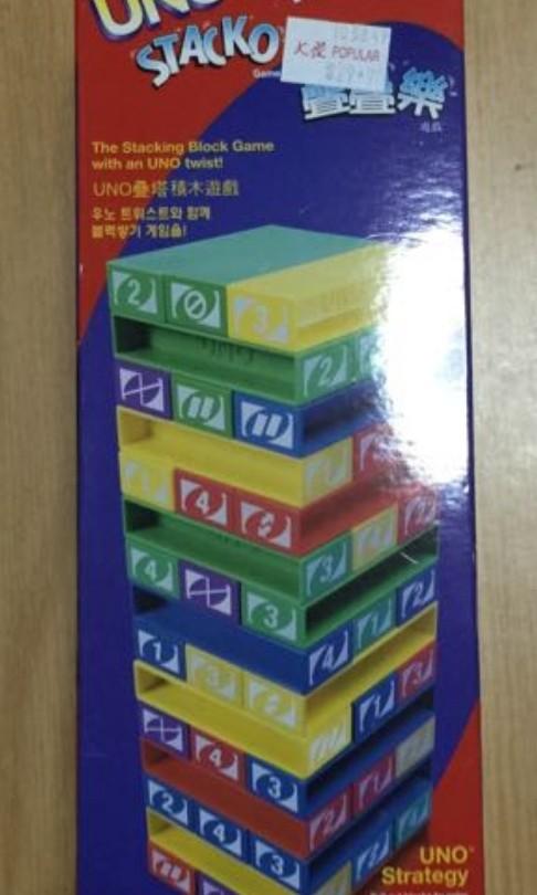 Uno Stacko (Used) (Category: Board Games & Puzzles) located in Singapore. Submitted by hikikomori_society (Listing ID 1018262230, Image 2). Description: Fixed price. Self collect. Cash on delivery. Used, in good playable condition. NOT the MINI Version. Original Size Version. Retail price: S$29.90. Selling at: S$15 nett. Meetup: Hougang, Xinmin Primary School Busstop No. 63381..