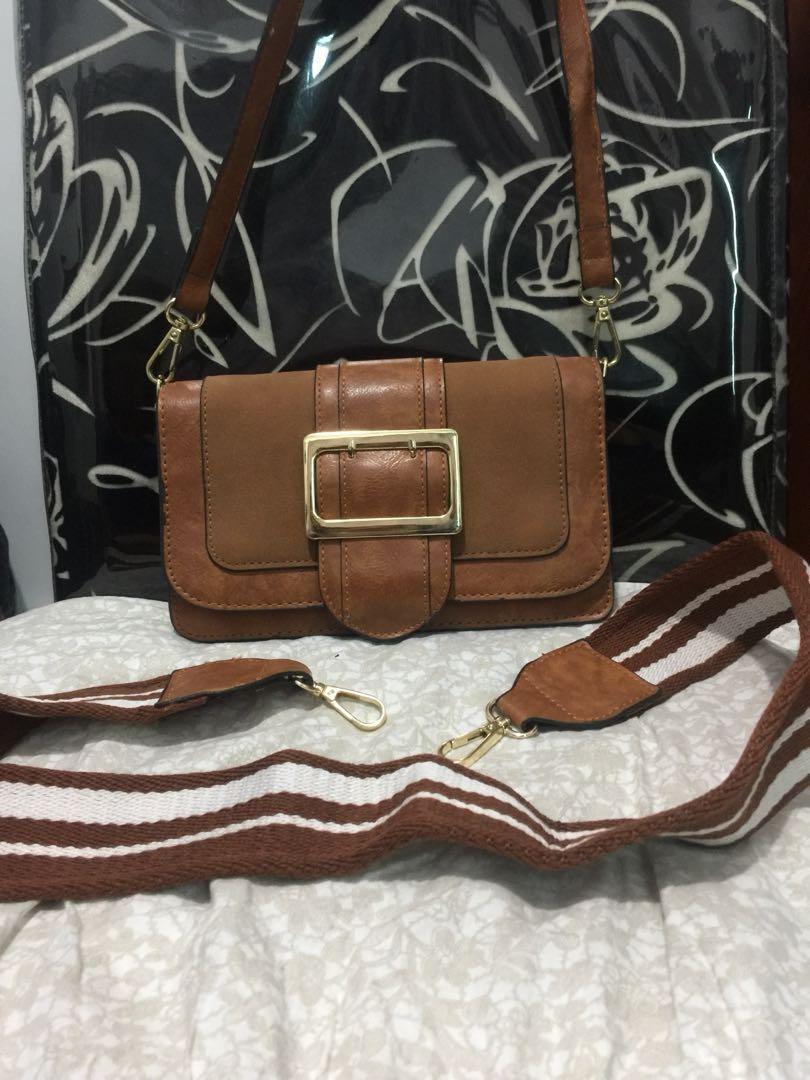 2 Design Shoulder Strap Sling Bag (Category: Shoulder Bags) located in Quezon City. Submitted by rmave (Listing ID 1018431700, Image 1). Description: Tan Sling Bag No Brand With 2 different bag strap design Brand New RFS: Decluttering, Closet Clean Up Price: P650 Last Price: P400 Pick Up Fee by the Buyer Location: Quezon City.