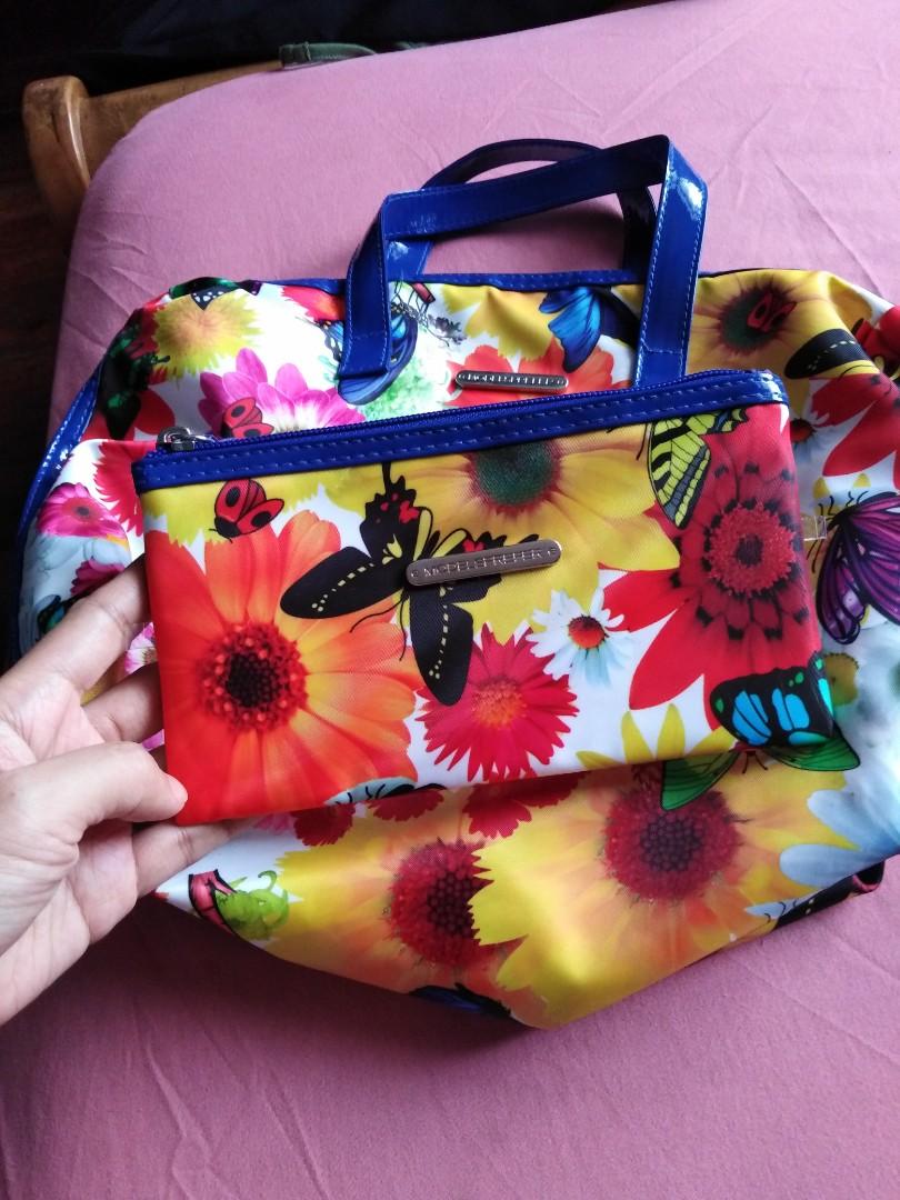 Colorful Floral Hand Bag with Wallet (Category: Purses & Pouches) located in Makati City. Submitted by mimmyche (Listing ID 1018451346, Image 2). Description: Colorful Floral Handbag with Wallet. Blue lining handle and full zipper. Very roomy inside. 13x11x4.5 Inches.