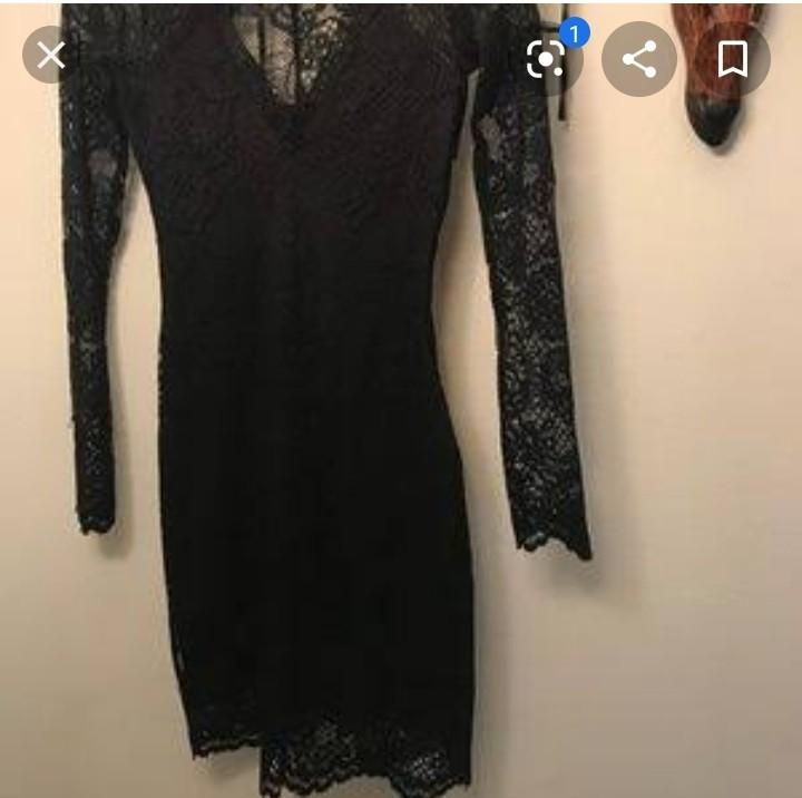 H&M Black Lace Dress (Category: Dresses) located in Makati City. Submitted by mimmyche (Listing ID 1018464570, Image 2). Description: This gorgeous H&M black lace dress is sexily sophisticated for any formal event. Beautiful lace patterned design with scalloped borders on v neck and on skirt hem. Polyester blend with spandex fit, Fully lined and long sleeve coverage, fitted waist is 12", hips are 13.5". From waist line to bottom hem is 17", shoul