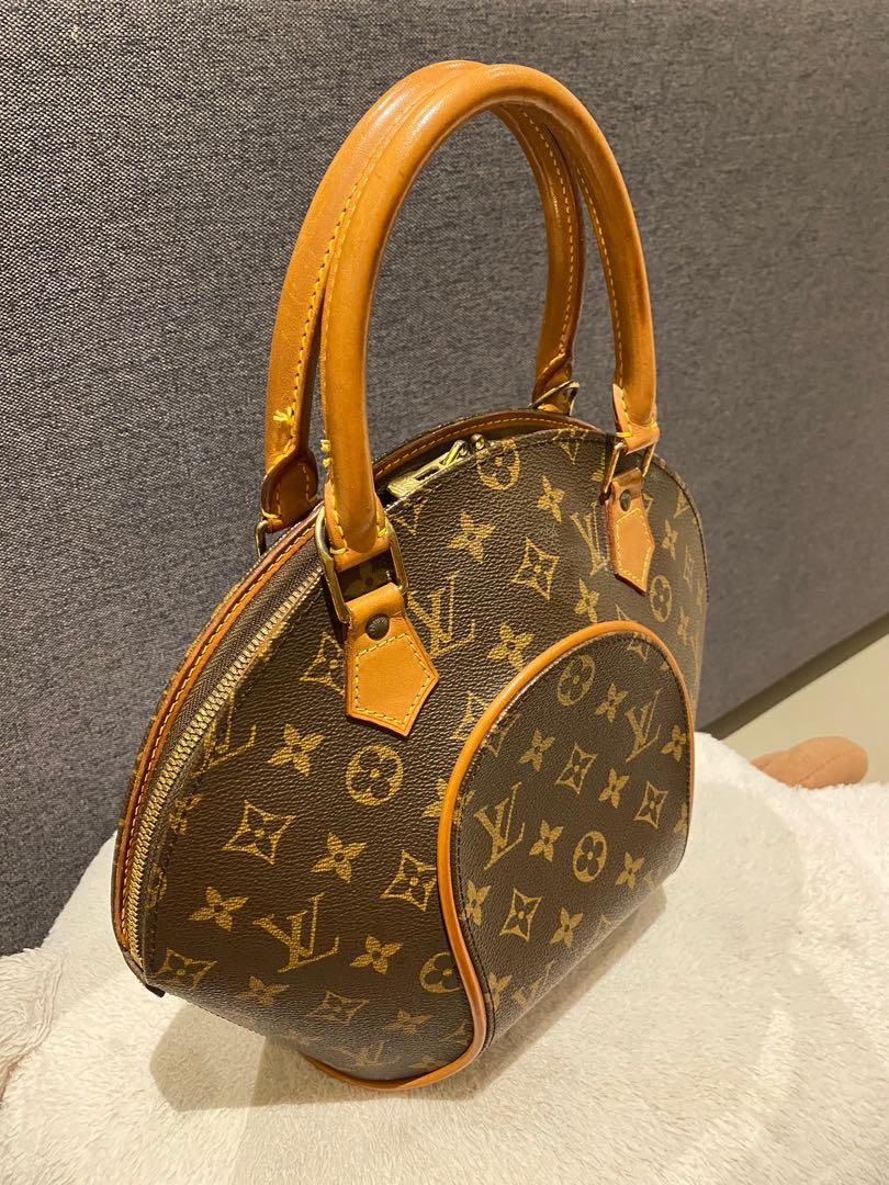 LOUIS VUITTON; a vintage 'Ellipse PM' top handle dark brown bag with Louis  Vuitton logo, tan leather handles and trim, height 26cm, diameter 36cm,  with dust bag.