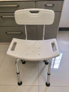 Adjustable height shower chair