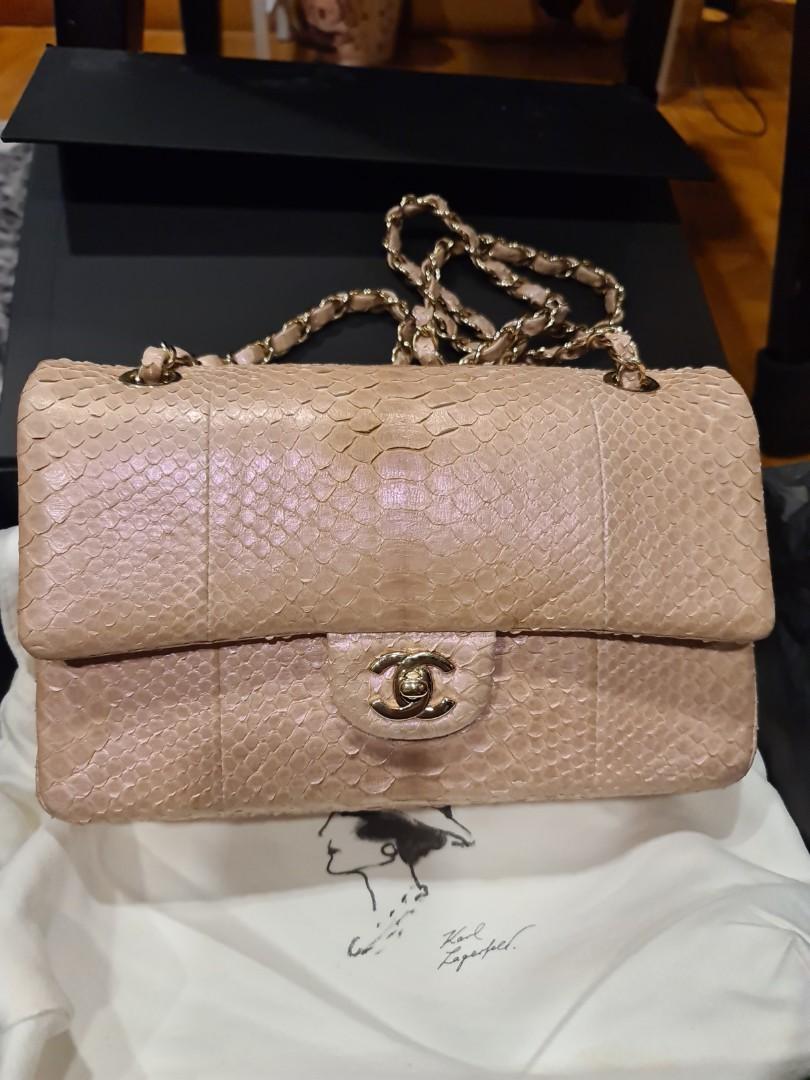 Authentic Chanel Pink Python Handbag (Category: Bags & Wallets) located in Singapore. Submitted by priced.to.sell (Listing ID 141583107, Image 2). Description: Size: Medium Color: Pink Condition: Good Exotic Python Skin (Chanel is not producing exotic skin anymore) Bought in Europe in 2012 Used a few times and not abused Comes with full box, dustbag, authenticity card and receipt Can verify at any Chanel boutique for authenticity View to offer.