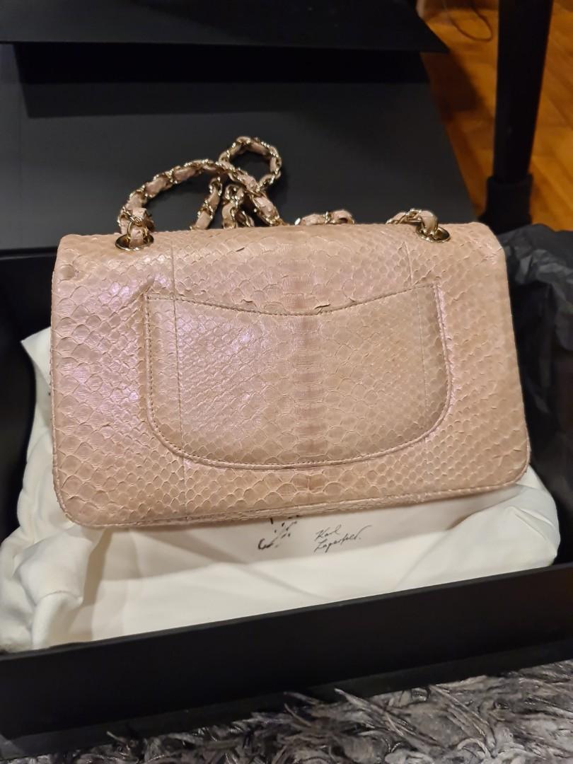 Authentic Chanel Pink Python Handbag (Category: Bags & Wallets) located in Singapore. Submitted by priced.to.sell (Listing ID 141583107, Image 3). Description: Size: Medium Color: Pink Condition: Good Exotic Python Skin (Chanel is not producing exotic skin anymore) Bought in Europe in 2012 Used a few times and not abused Comes with full box, dustbag, authenticity card and receipt Can verify at any Chanel boutique for authenticity View to offer.