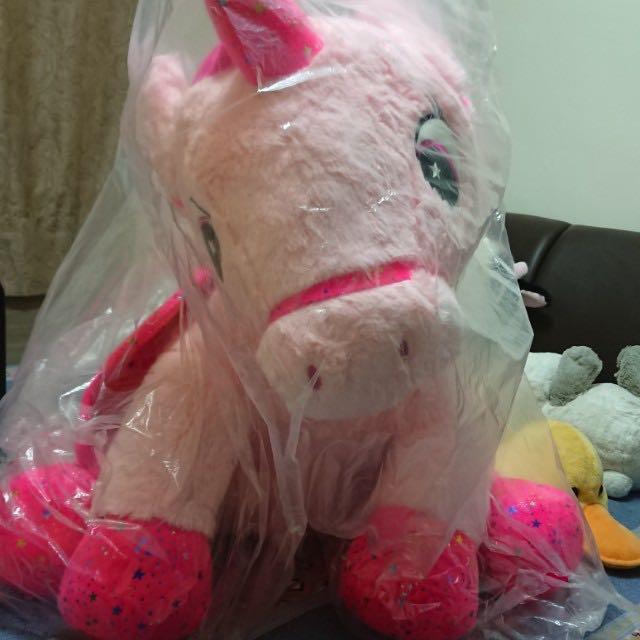 huge pink unicorn stuffed animal