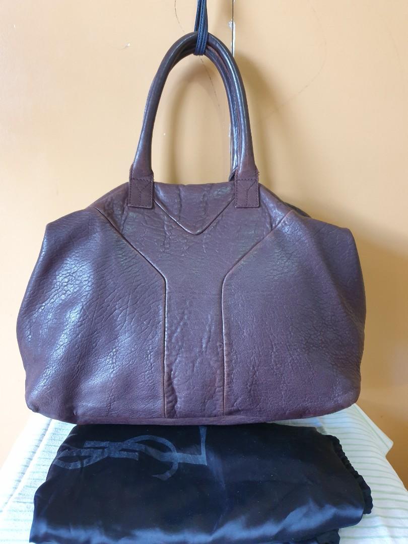 YSL Easy Bag (Category: Luxury Bags & Wallets) located in Paranaque City. Submitted by ktscollective (Listing ID 1018662003, Image 2). Description: Preloved, GUC. Includes dustbag, chocolate brown in color. Size is 17in x 12in x 6in (depth). Shipping c/o buyer..