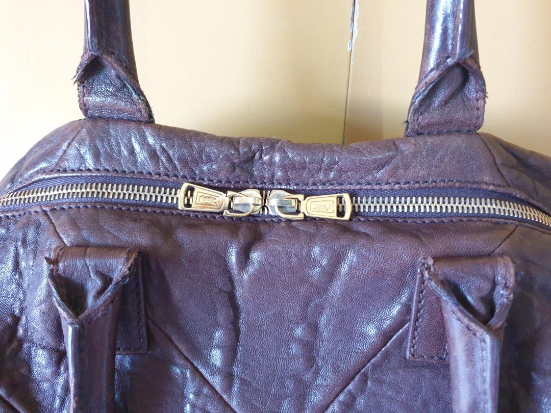 YSL Easy Bag (Category: Luxury Bags & Wallets) located in Paranaque City. Submitted by ktscollective (Listing ID 1018662003, Image 3). Description: Preloved, GUC. Includes dustbag, chocolate brown in color. Size is 17in x 12in x 6in (depth). Shipping c/o buyer..