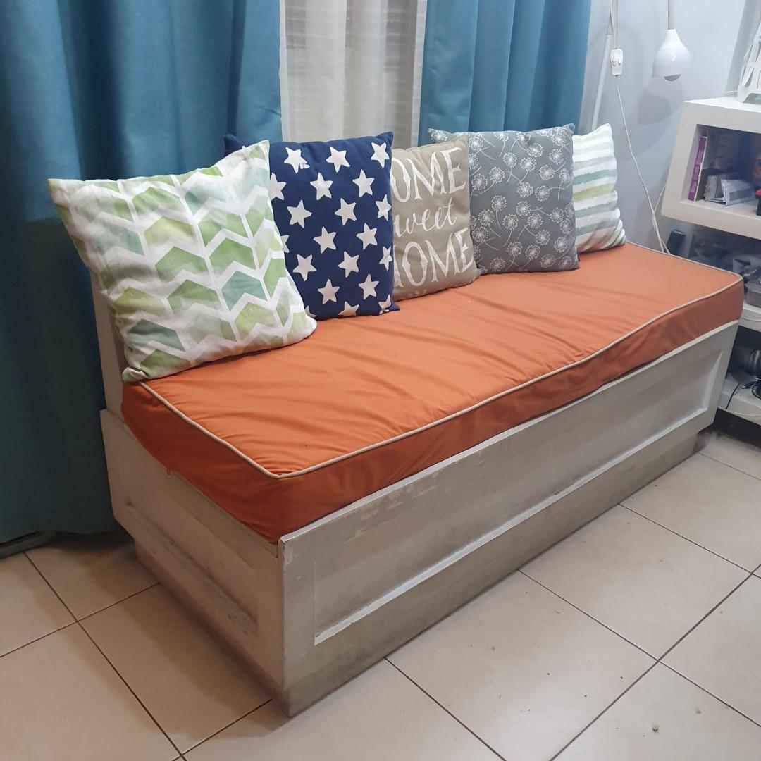 ‼️ Cozy Storage Couch with Uratex Memory Foam ‼️ (Category: Other Kids Furniture) located in Taguig. Submitted by kaiganda (Listing ID 1019052560, Image 2). Description: Great as sofa or banquet seat for dining 😊 Quantity: 2 sets available for P3,500 each or P6,800 only for both Each SET includes: 1 wooden bench with slanted backrest 1 Uratex memory foam with suede upholstery FREE extra cover and 2 throw pillows Condition: 2nd Hand Material: Ply