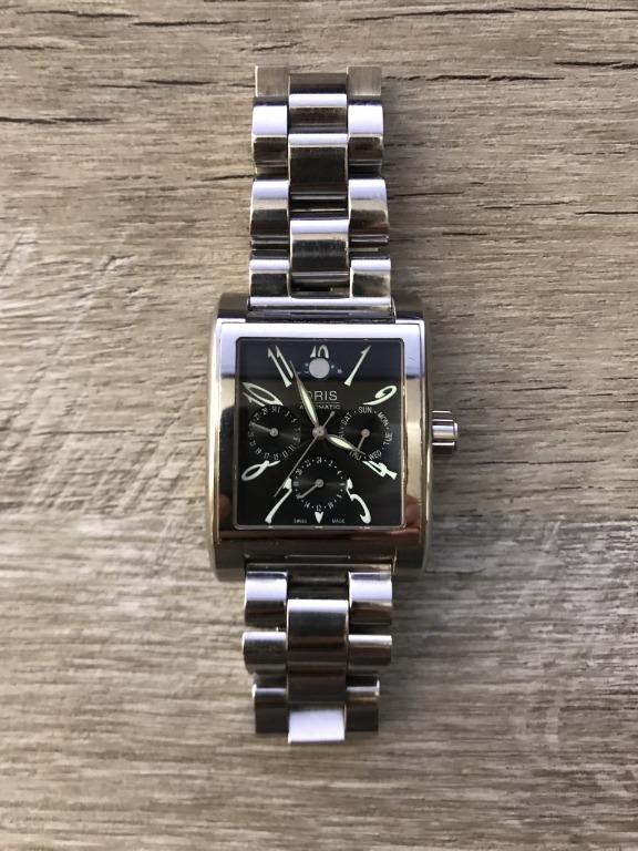 Oris Moonphase Rectangle Watch (Category: Watches) located in Singapore. Submitted by 397341257 (Listing ID 1018892282, Image 1). Description: Oris Moonphase Rectangle Watch with Date Day and GMT functions. All functions working properly. Condition 7/10.