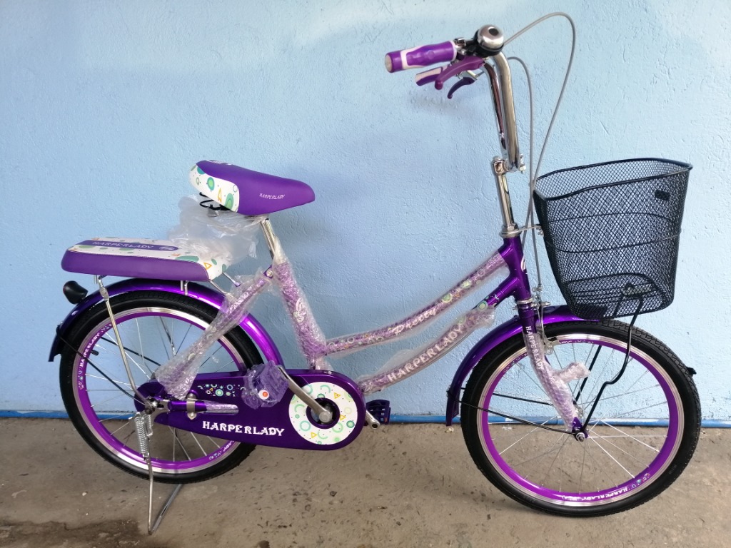 purple bicycle with basket