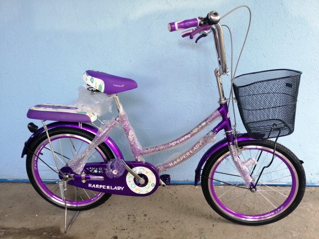 purple bike with basket